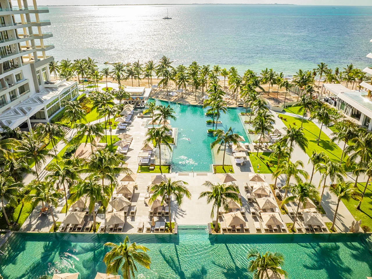Aerial view of the main pools, palm gardens, and Caribbean beach