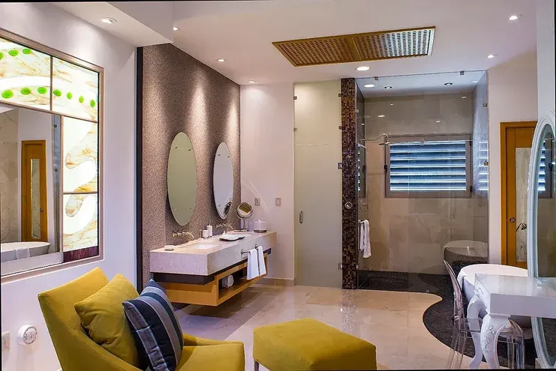 En-suite bathroom with walk-in shower and twin basins