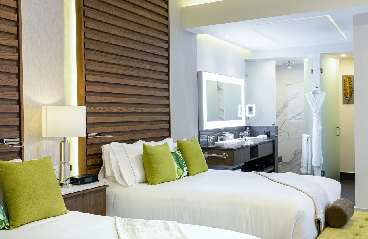Bedroom with crisp white linens and en-suite bath