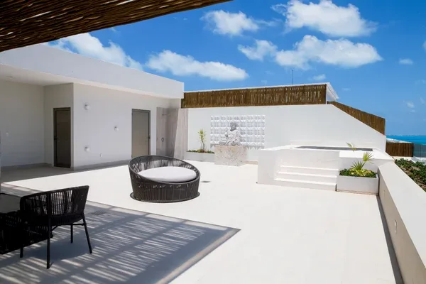 Private rooftop terrace with jacuzzi and lounge bed