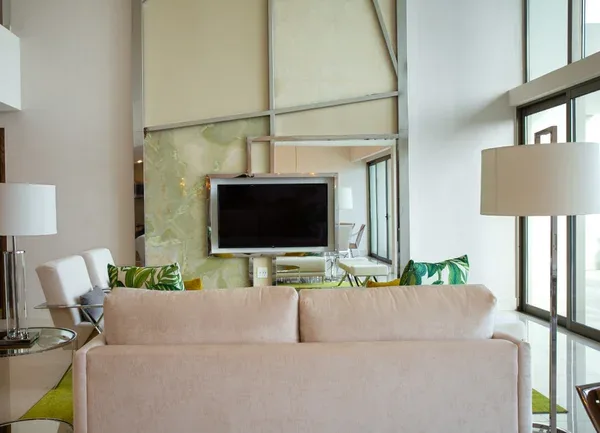 Lounge with designer sofa and onyx feature wall